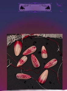 Detail of Halloween almond press-on nails with 3D gradient finish and stitch patterns