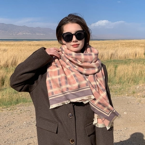 Stylish women's pink plaid scarf with fringe, soft warm winter shawl and elegant daily fashion wear.