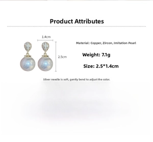 Detailed view of pearl earrings with dimensions 2.5x1.4cm and silver needles