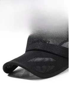 Detail of breathable honeycomb mesh visor and embroidered logo on black outdoor cap