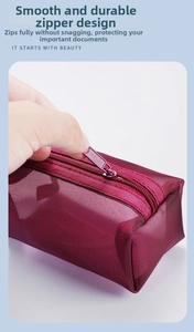 Detail showing smooth zipper closure on wine red nylon mesh storage bag with semi-transparent view