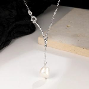 Detail of S925 silver branch necklace with baroque freshwater pearl on stone