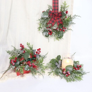 Mini Christmas wreath with eucalyptus leaves, pine needles, red berries and plaid bow