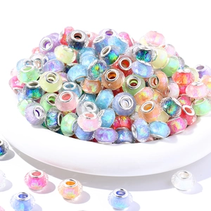 Stack of resin faceted large hole beads with iridescent laser patterns and metal cores