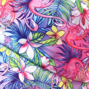 Detail of pink flamingo and tropical palm leaf print on high-quality twill fabric hat