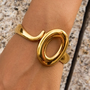 Minimalist 18K gold stainless steel bangle with abstract irregular geometric design
