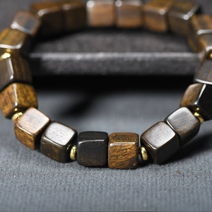 Agarwood square bead bracelet with dark wood grain and golden metal spacers