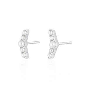 Detail of s925 silver curved earrings with five graduated white pearls on white background