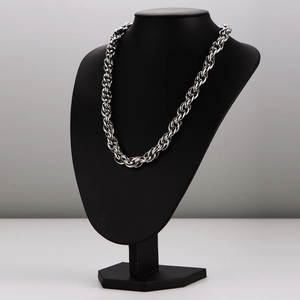 Sleek silver stainless steel twisted rope chain necklace shown on a black portrait bust
