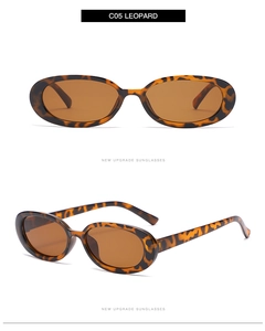 Detail view of leopard print oval sunglasses with brown lenses on a white background
