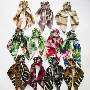 Set of 11 satin hair scrunchies with long ribbons in diverse colorful patterns