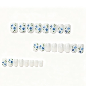 Blue floral press-on nails with silver glitter gradient design on white base, 24 pieces