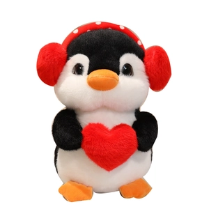 Plush penguin doll with red heart and polka dot earmuffs for comfort and gifting