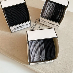 Pack de trois boîtes d'élastiques à cheveux tressés noirs et gris pour queue de cheval