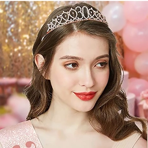 Close-up of golden 30th birthday rhinestone crown tiara worn by a girl at a party