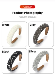 Detail of wide padded headbands in white grey and black with glitter and pearls