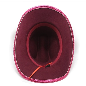 Detail of burgundy cowboy hat featuring rose red sequins and internal red size adjustment cord