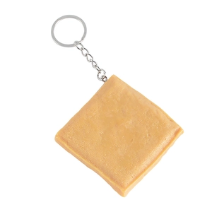 Realistic PVC dried tofu keychain showing detailed texture and silver metal ring