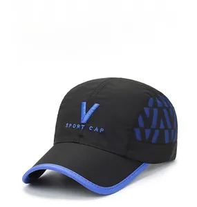 Detail of blue V letter embroidery and sport cap text on black quick dry fabric