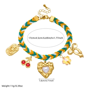 Colorful woven rope bracelet with cherry, pearl heart and bow pendants in gold finish