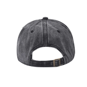 Detail of adjustable metal buckle and vintage washed cotton texture on baseball cap back