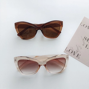 Retro cat-eye oversized sunglasses in dark brown and translucent champagne finishes