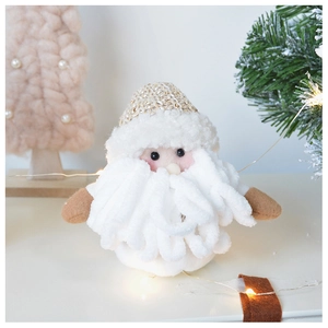 Detail of handcrafted knitted Santa Claus figurine with soft wool texture and festive decor