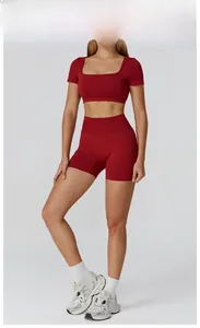 Detail view of seamless cherry red yoga set featuring hollow-out back and high-waist shorts