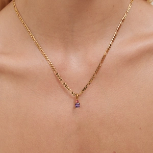 Elegant 18K gold Figaro necklace featuring a pink and purple square zircon pendant on model