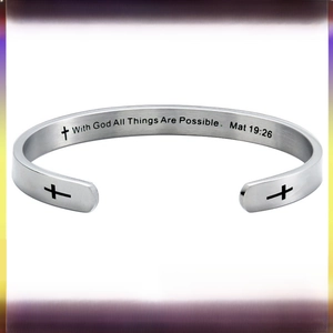 Macro view of brushed stainless steel cuff with engraved cross and bible verse