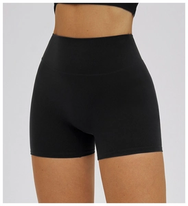 Close-up of black high-waisted yoga shorts featuring tummy control and seamless design