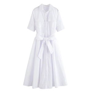 Detail view of white poplin shirt dress featuring short sleeves and tie-waist bow