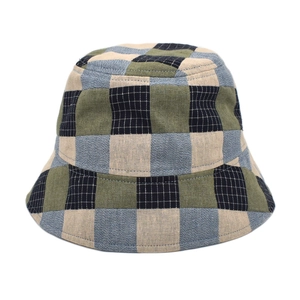 Detail of colorful checkered cotton bucket hat showing woven texture and plaid pattern