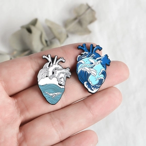 Blue whale and ocean wave enamel pins in anatomical heart shape for denim jackets