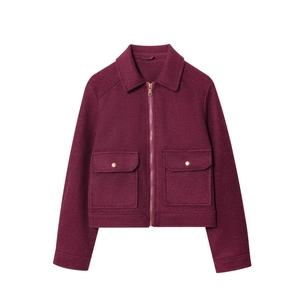 Detailed view of dark red wool-textured jacket with zipper and large flap pockets