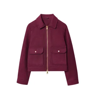 Detailed view of dark red wool-textured jacket with zipper and large flap pockets