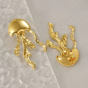 Polished gold jellyfish stud earrings in minimalist flowing stainless steel design