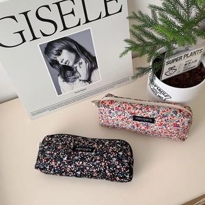 Floral corduroy pouches in cream and black with vintage merciparis brand labels