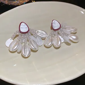 Bohemian seashell and pearl tassel earrings with starfish details in a chic fan shape