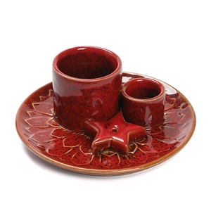 Red ceramic incense burner set with star accessory and sun relief tray in Nordic style