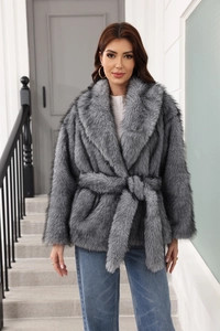Close-up of grey faux fur coat featuring a stylish lapel and matching waist belt detail