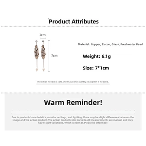 Detailed specs of tassel earrings with freshwater pearls and cubic zirconia on white background