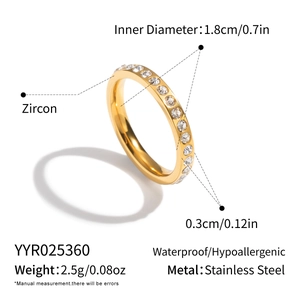 Close-up of golden stainless steel ring with zircon inlays and detailed dimensions