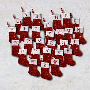 Detailed heart-shaped layout of sequined Christmas stockings with letter embroidery