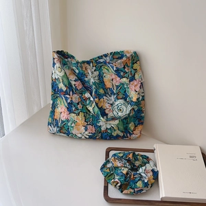 Flat lay of floral cotton tote bag with matching scrunchie in oil painting style