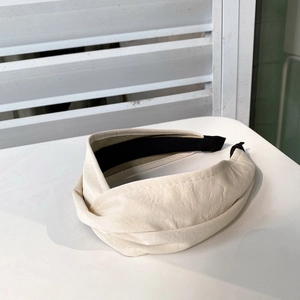 Elegant beige wide pleated faux leather headband for women with black non-slip lining