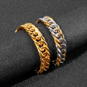 Detail of gold and two-tone stainless steel braided rings in a hip-hop style