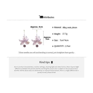Detail showing dimensions and material of purple resin flower earrings with zircon