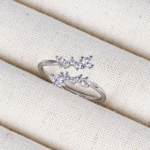 Close-up of double-layered silver open ring with sparkling pavé cubic zirconia