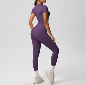 Side view of dark purple women's seamless yoga set showing slim fit and shaping effect